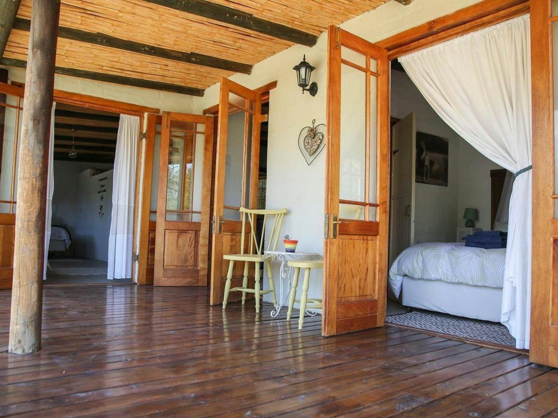 Bedroom opening onto the wooden stoep